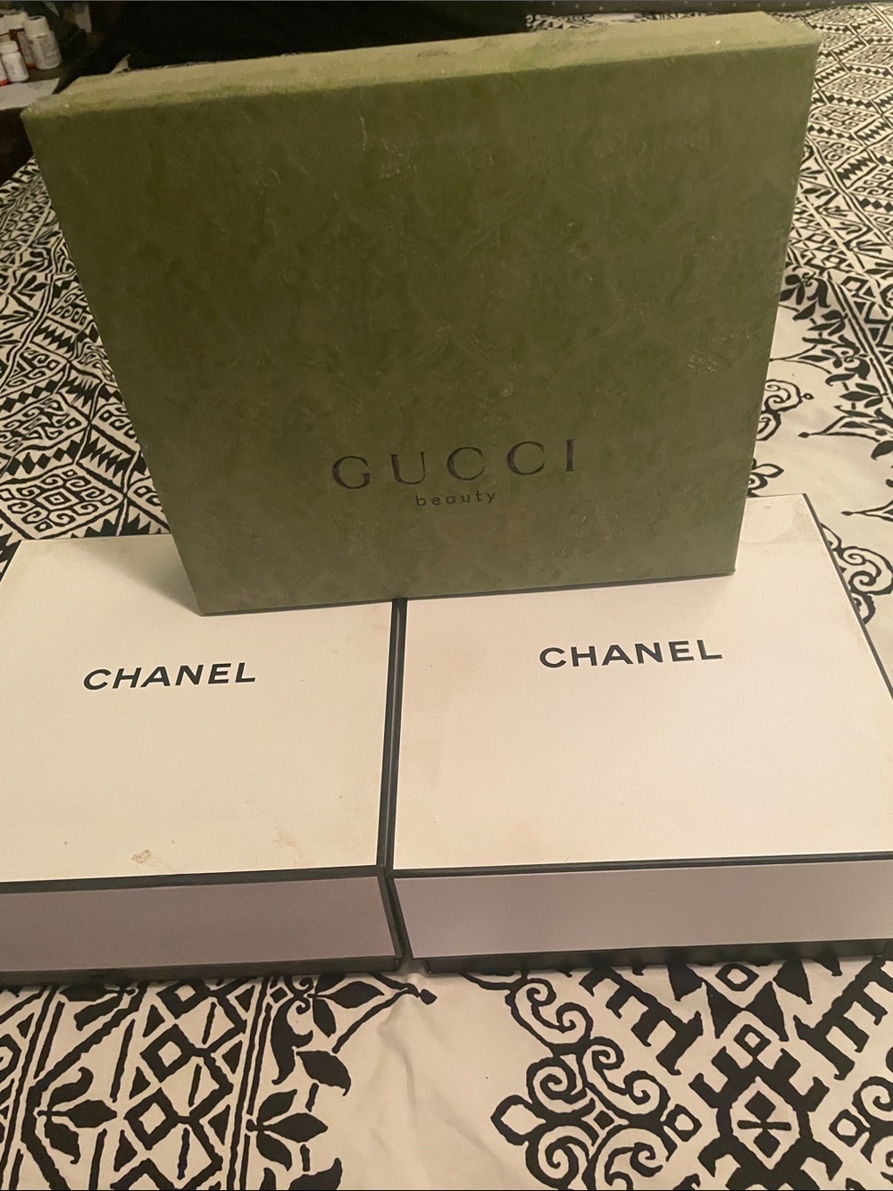Gucci and Chanel boxes